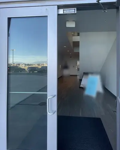 Photo of the glass east entrance doors opening into the lobby